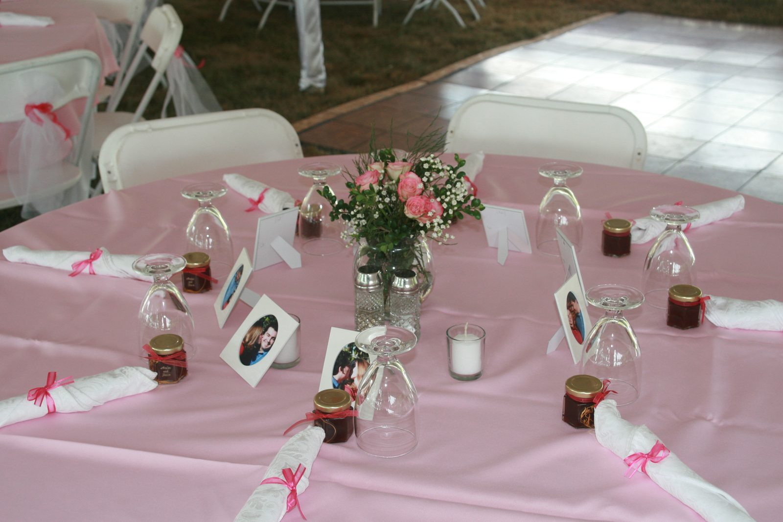 The tables before we came and mussed them all up.  Wedding favors included the little pictures...